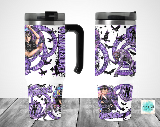 Travel mug with purple and black design on a white background