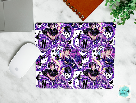 Mouse pad with purple design on a marble surface