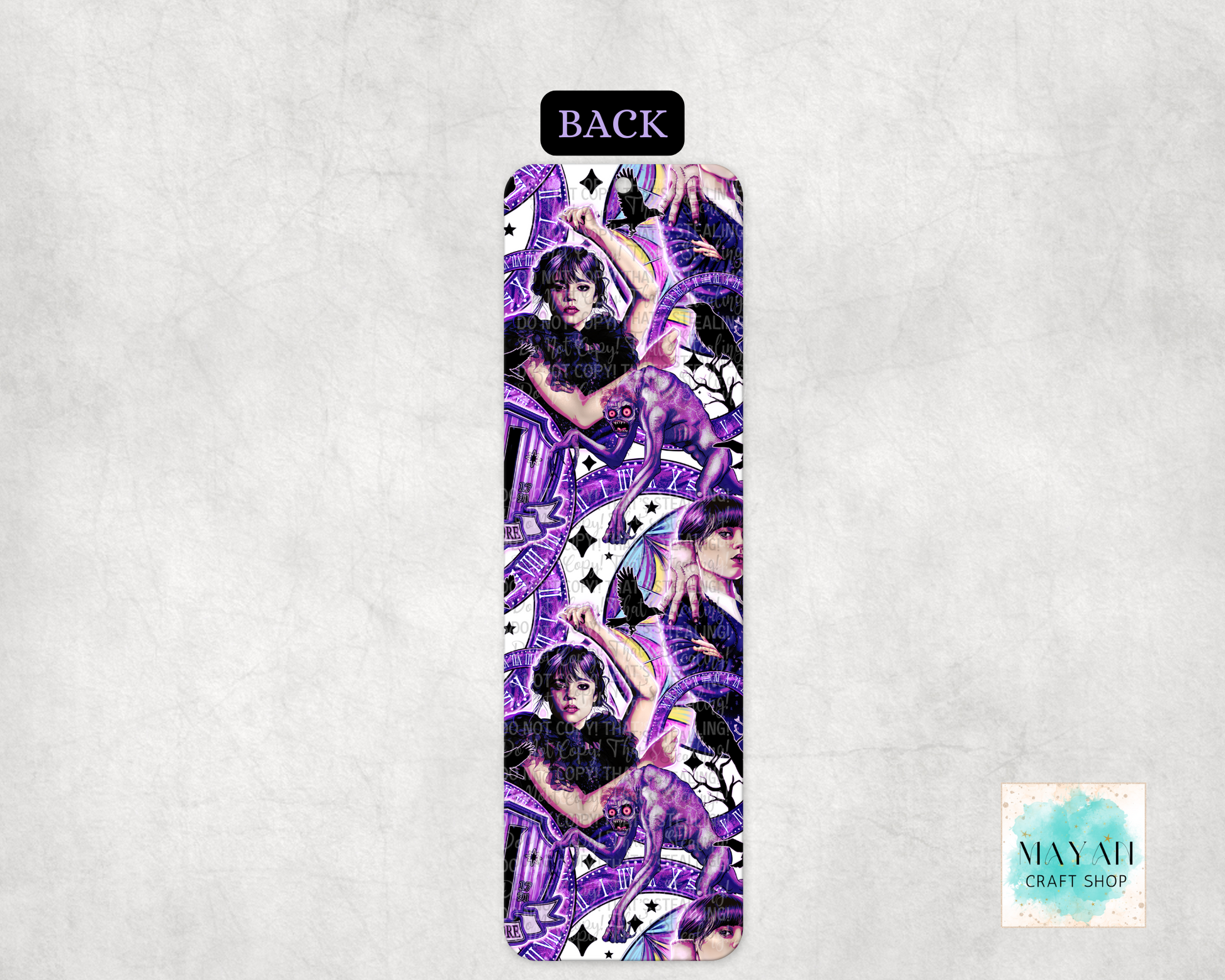 Bookmark with a purple and black design on a light gray background.
