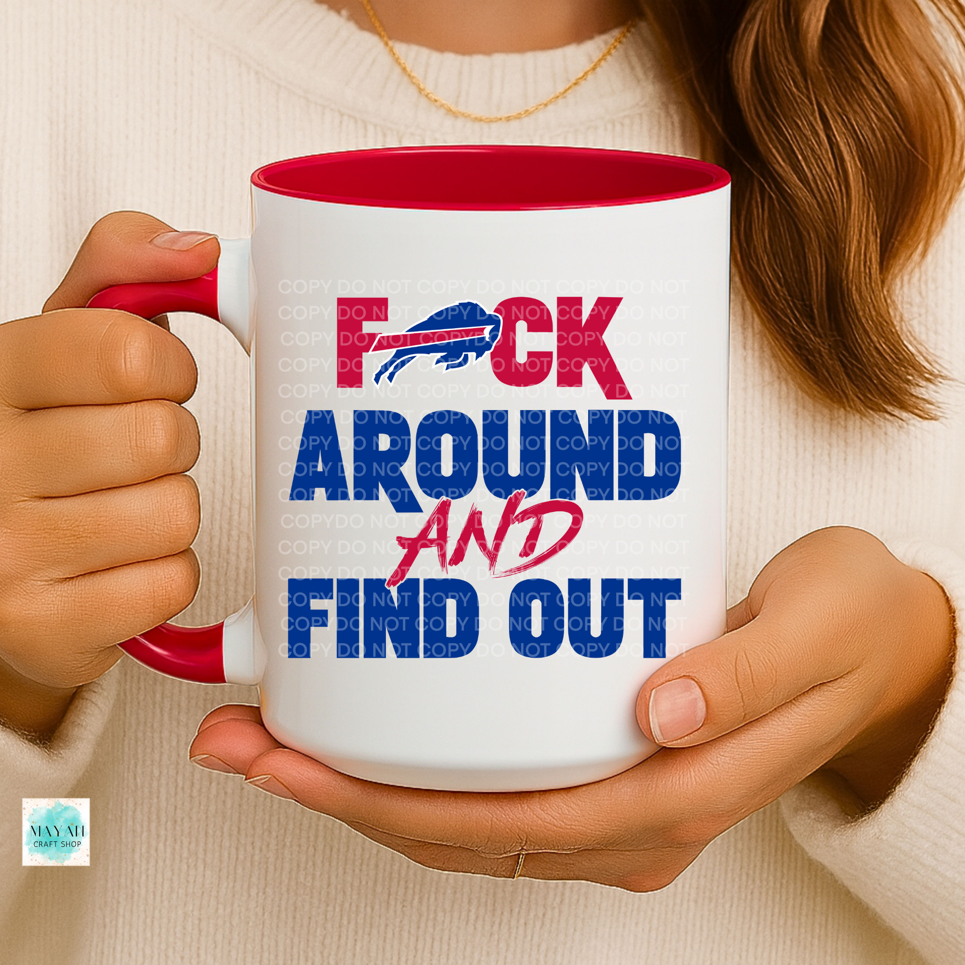 Person holding a mug with text and logo