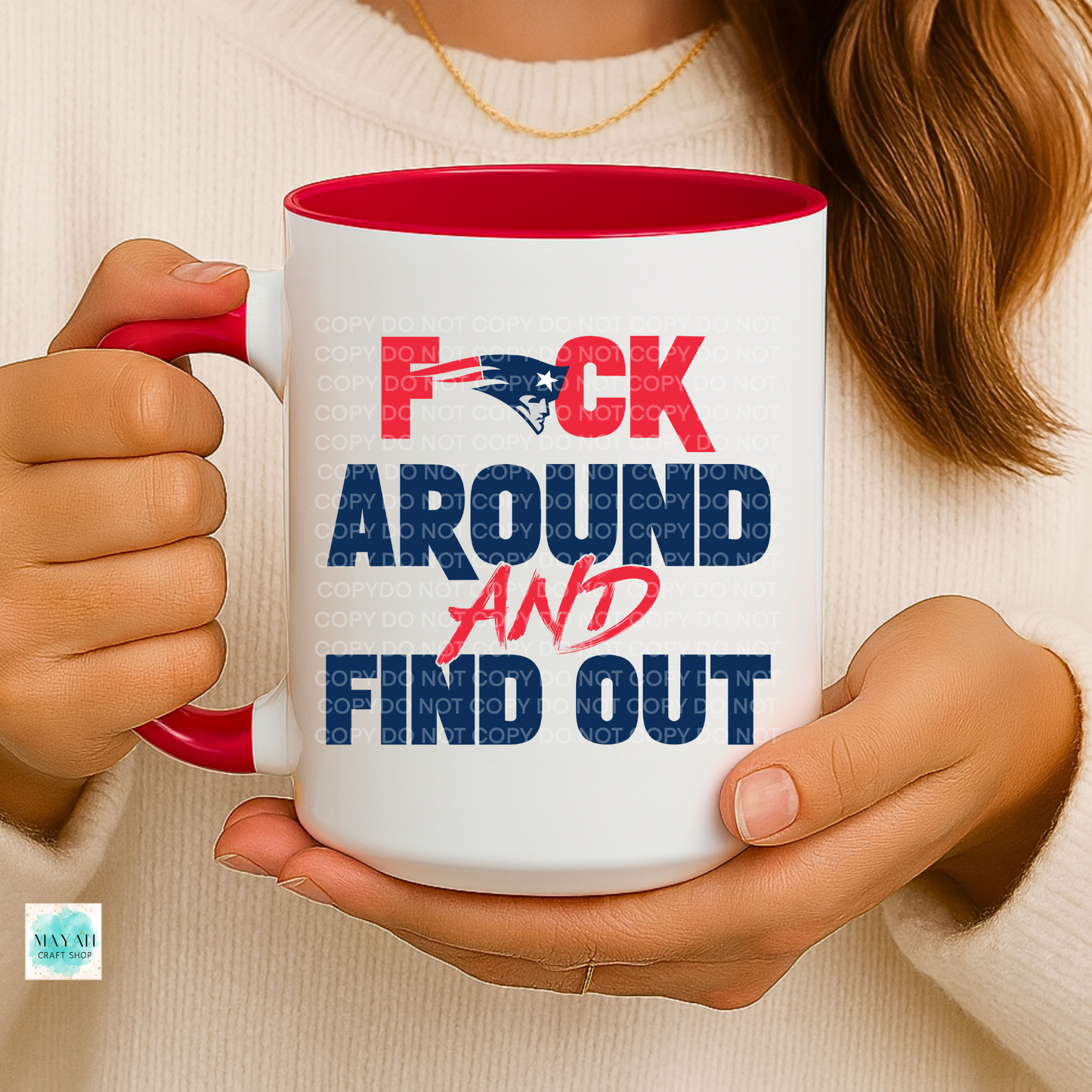 Person holding a mug with text and logo
