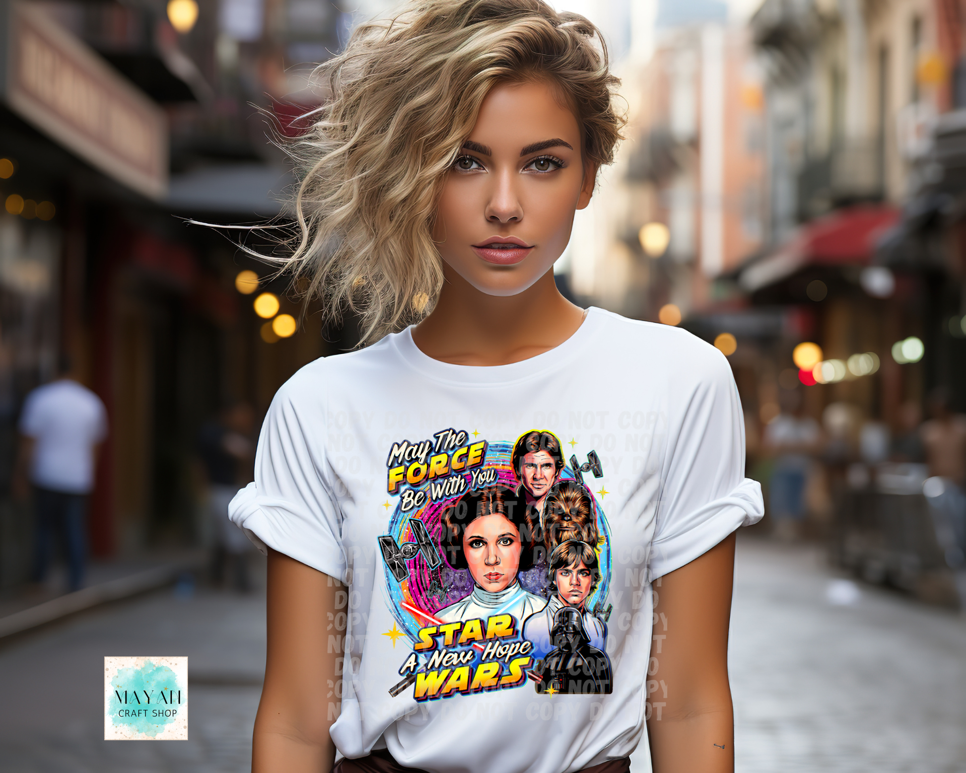 Woman wearing a white t-shirt with a movie graphic design on a city street.