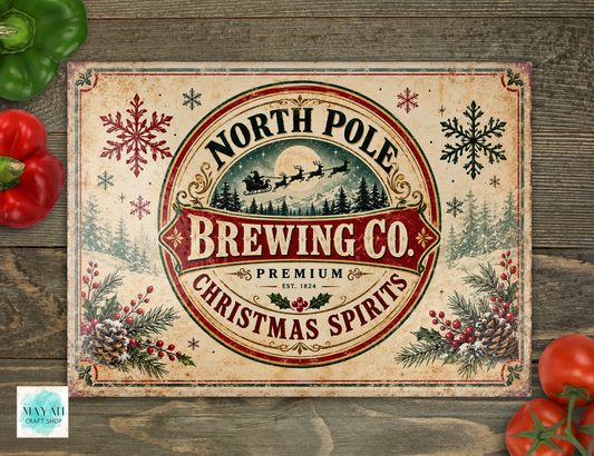 A cutting board with a rustic cream background and a large central circular emblem reading “North Pole Brewing Co. Christmas Spirits,” surrounded by red snowflakes, evergreen branches, pinecones, and holiday berries.