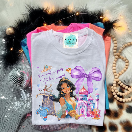 Children's t-shirt with princess design on a textured surface.