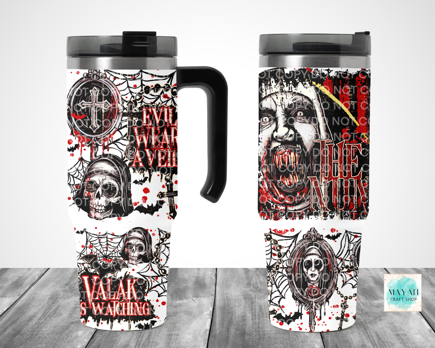 Two views of a travel tumbler mug with a gothic horror design featuring skulls, spiders. The tumbler has a black handle and lid, shown on a gray wood-textured background.