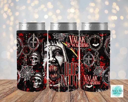 Three slim can coolers with silver aluminum can tops, featuring a gothic horror design with skulls, caskets, cobwebs, on a black background, displayed on a wooden surface with a soft bokeh light background.