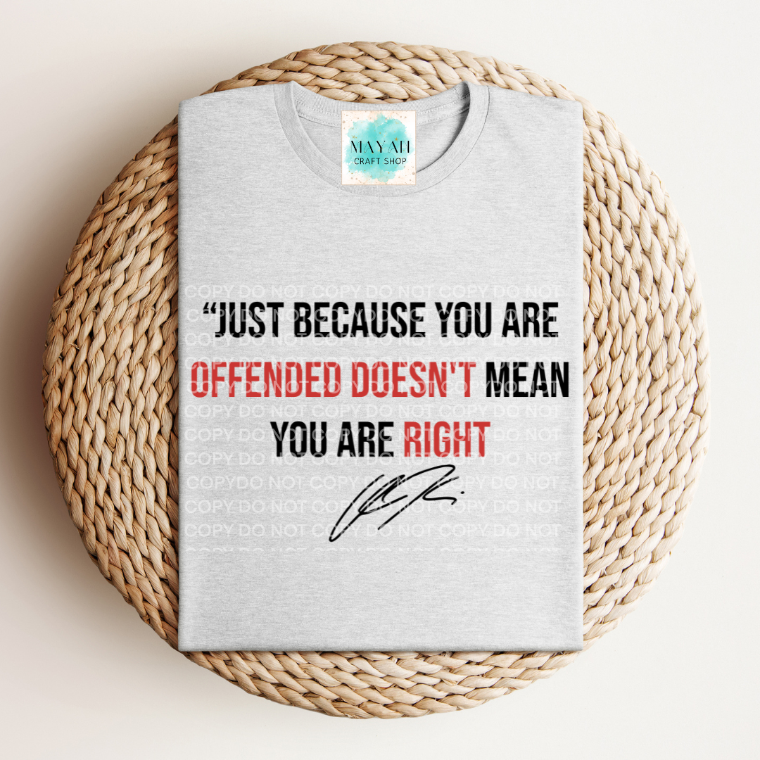 Gray t-shirt with a motivational quote on a woven mat