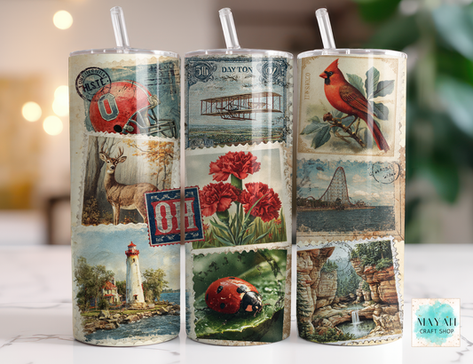 Three cylindrical tumbler with vintage-style designs on a white surface.