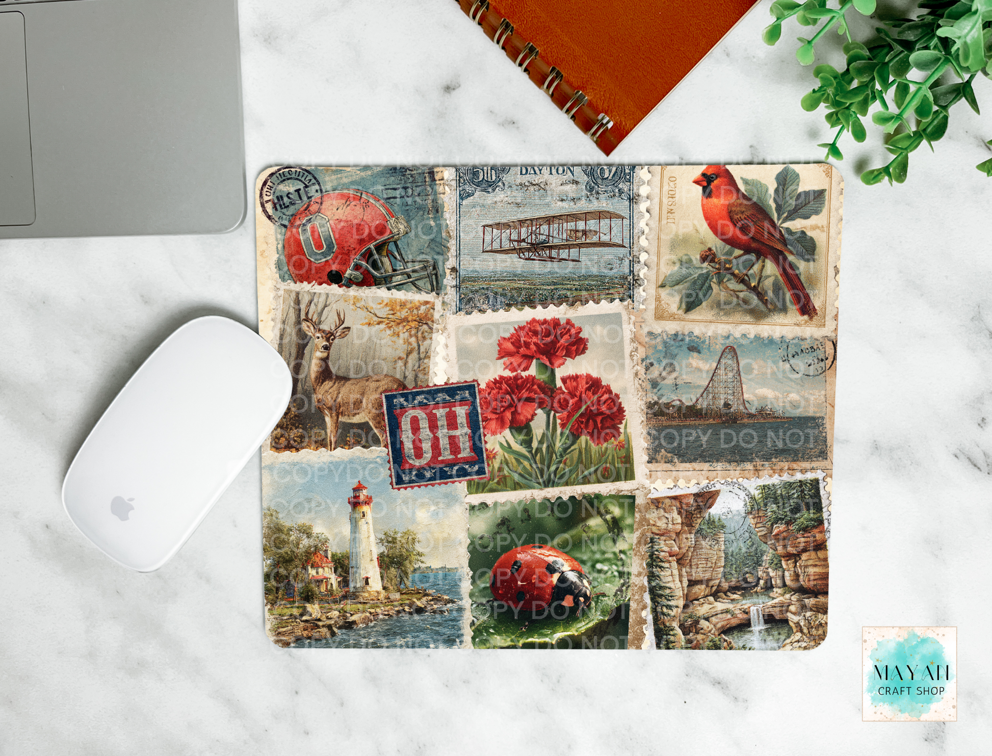 Mouse pad with vintage-style design featuring a bird, flowers, and landscapes on a marble surface.