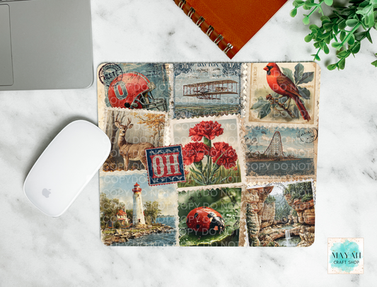 Mouse pad with vintage-style design featuring a bird, flowers, and landscapes on a marble surface.