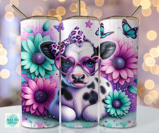 Three tumbler designs featuring a cow with sunglasses, flowers, and butterflies on a blurred bokeh background.