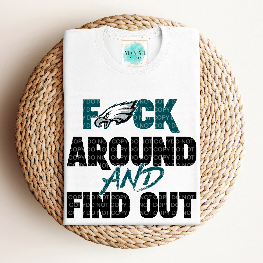 White t-shirt with graphic design and text on a woven surface