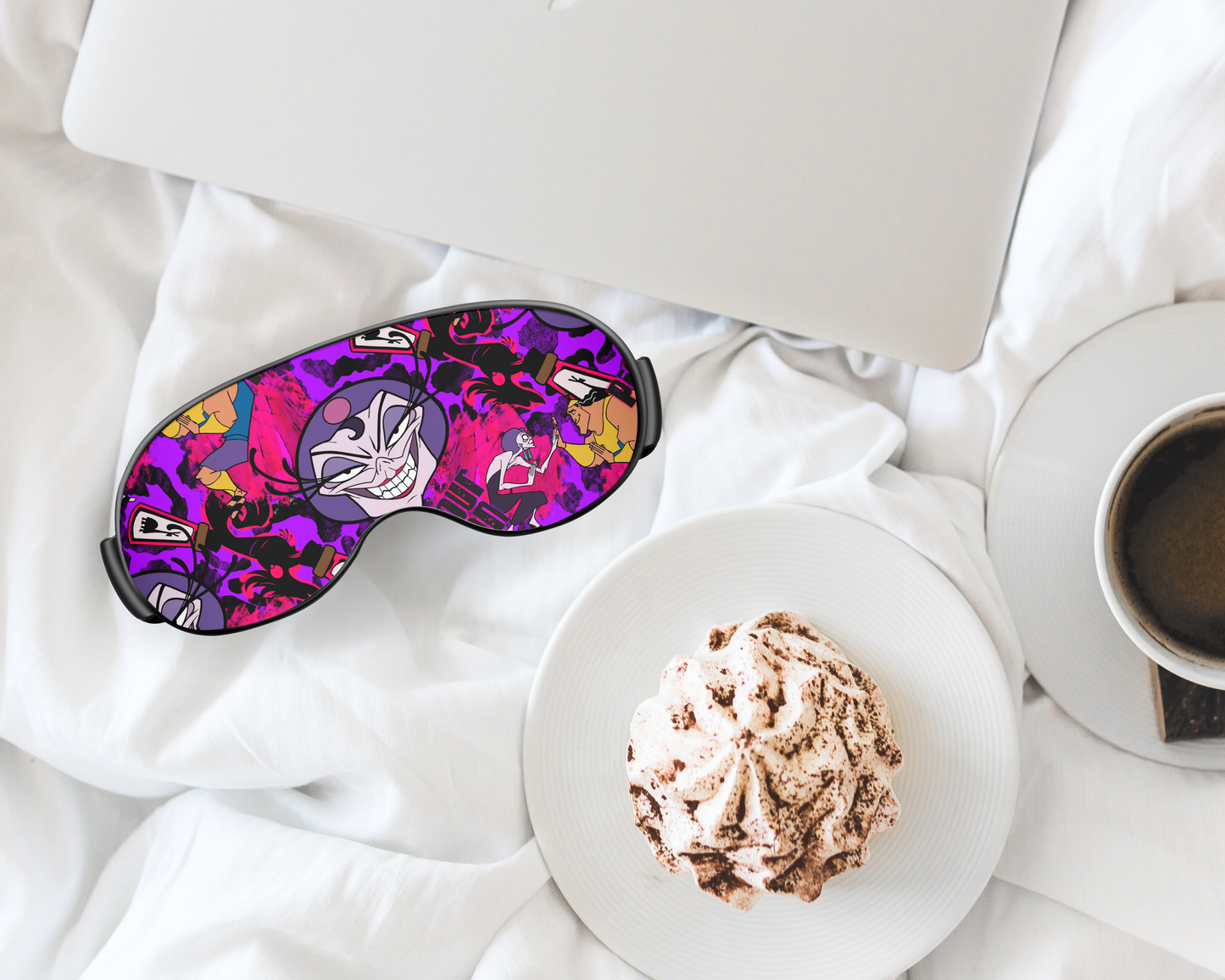 Colorful sleep mask on a white surface with a plate of food and a cup of coffee.