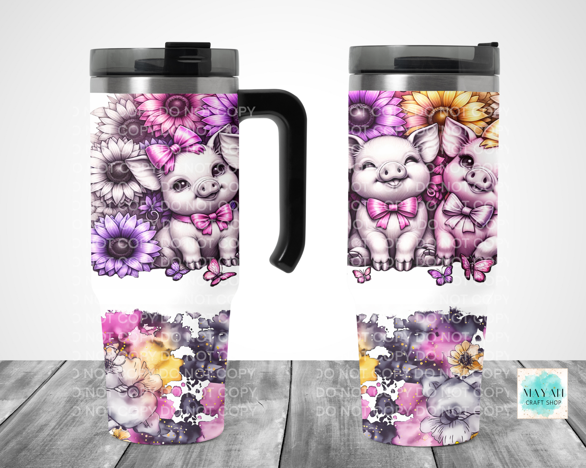 Set of travel mugs with cute pig illustrations and floral designs on a wooden surface.