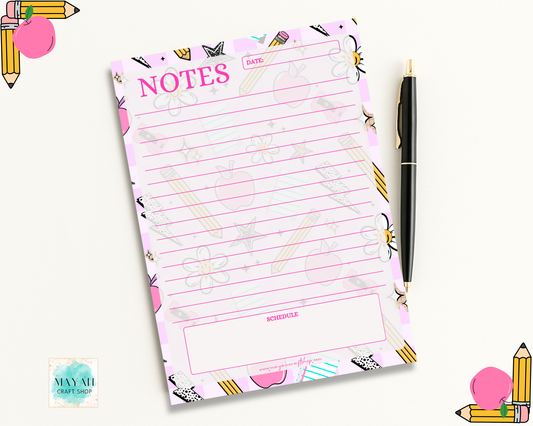 Notepad with 'NOTES' and 'DATE' text, surrounded by stationery items on a white background.