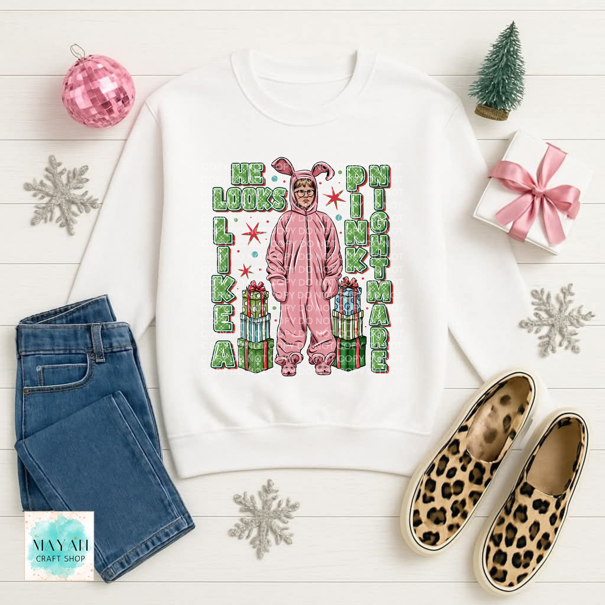 Christmas sweatshirt with pink pajamas.