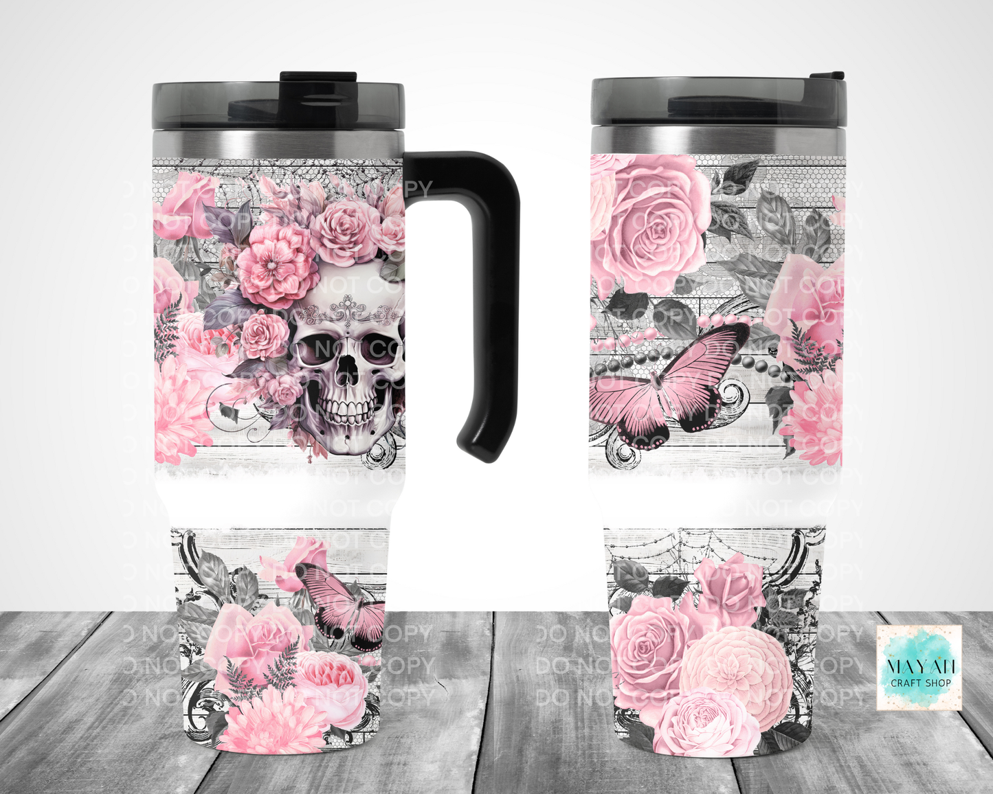 Travel mug with skull and floral design on a white background
