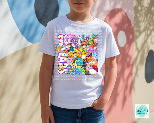 Child wearing a white t-shirt with colorful graphic design and text, standing against a multicolored abstract background.