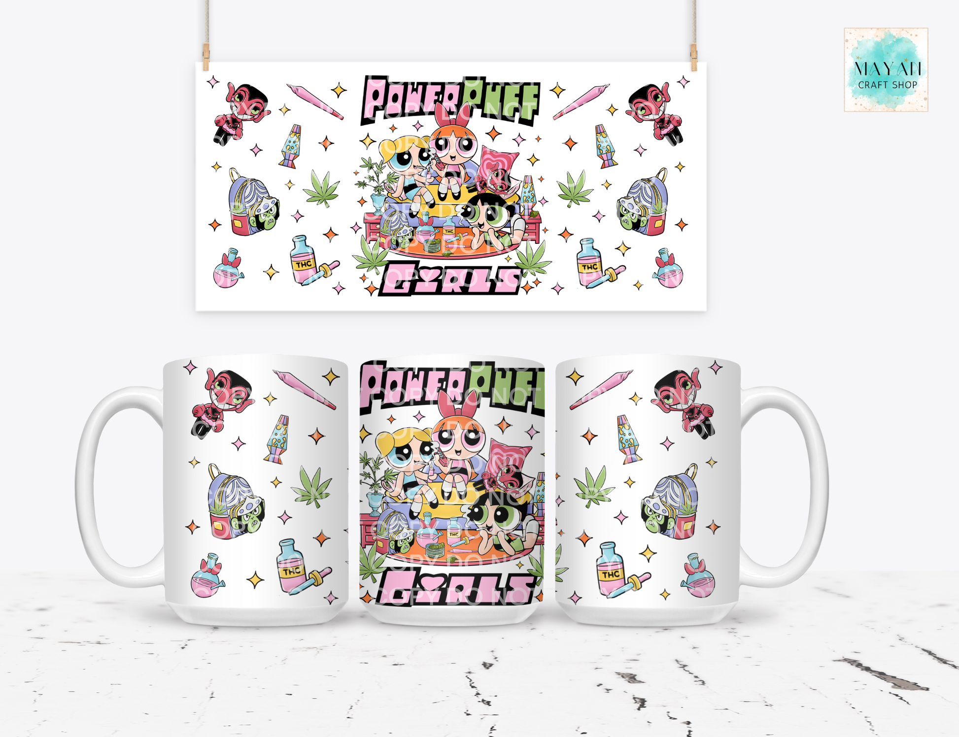 Three mugs with vibrant design on a white surface