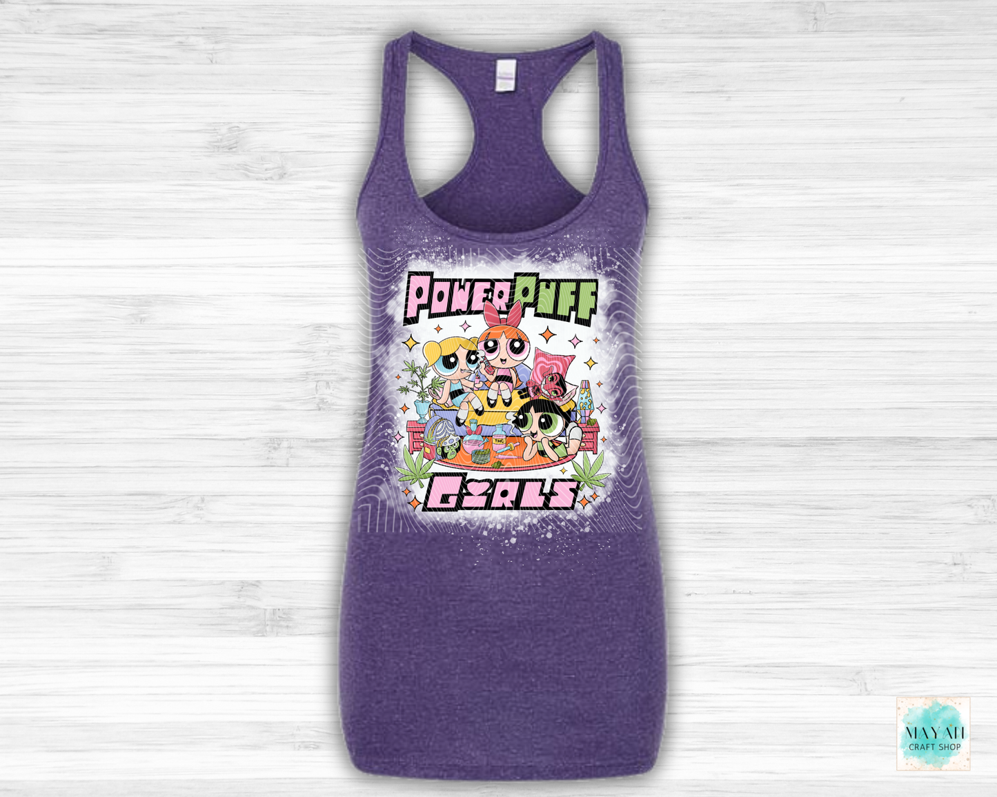 Purple tank top with vibrant graphic on a light wooden background