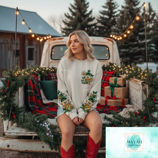 Woman in a decorated truck bed with Christmas decorations and lights.