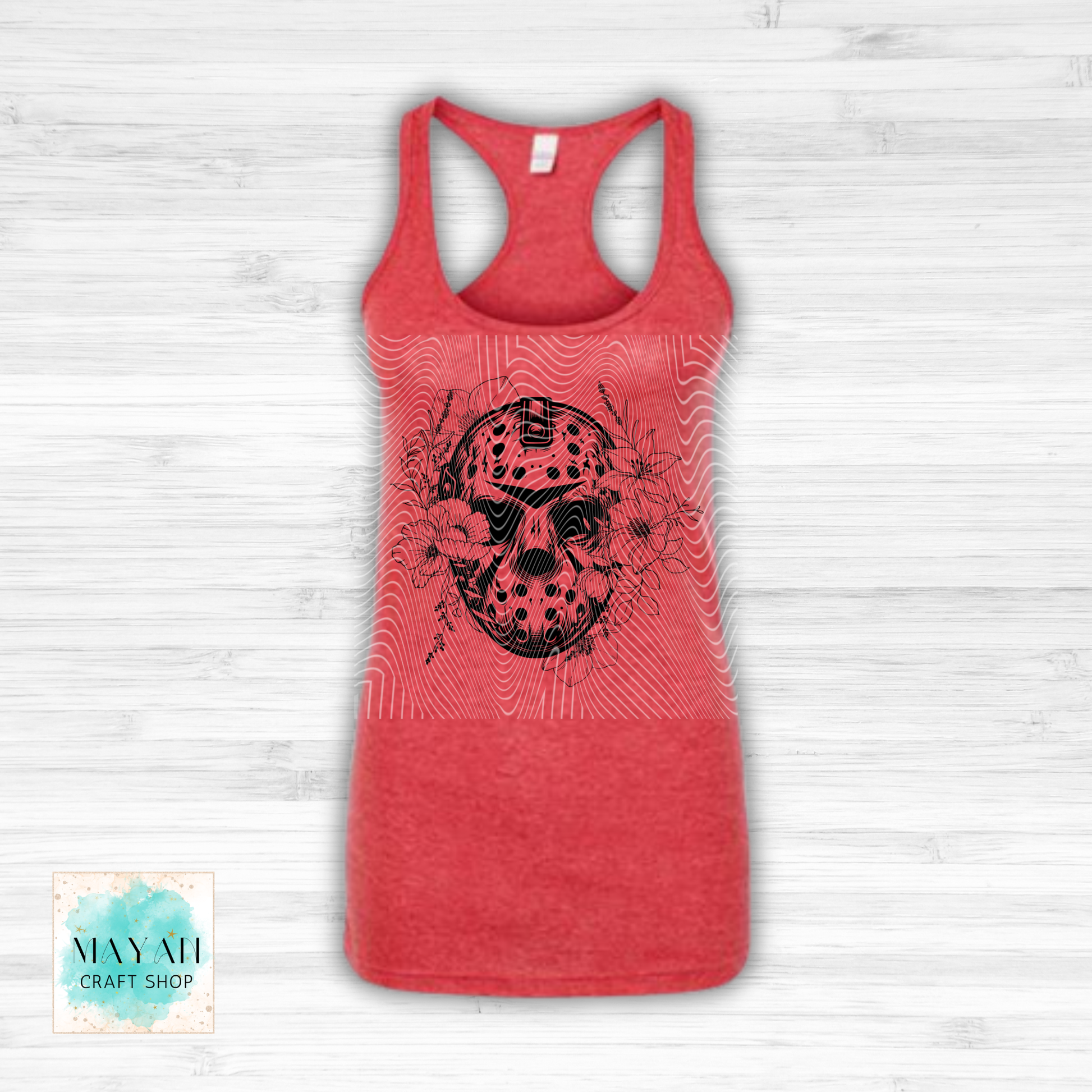 Red tank top with a skull design on a white wooden background