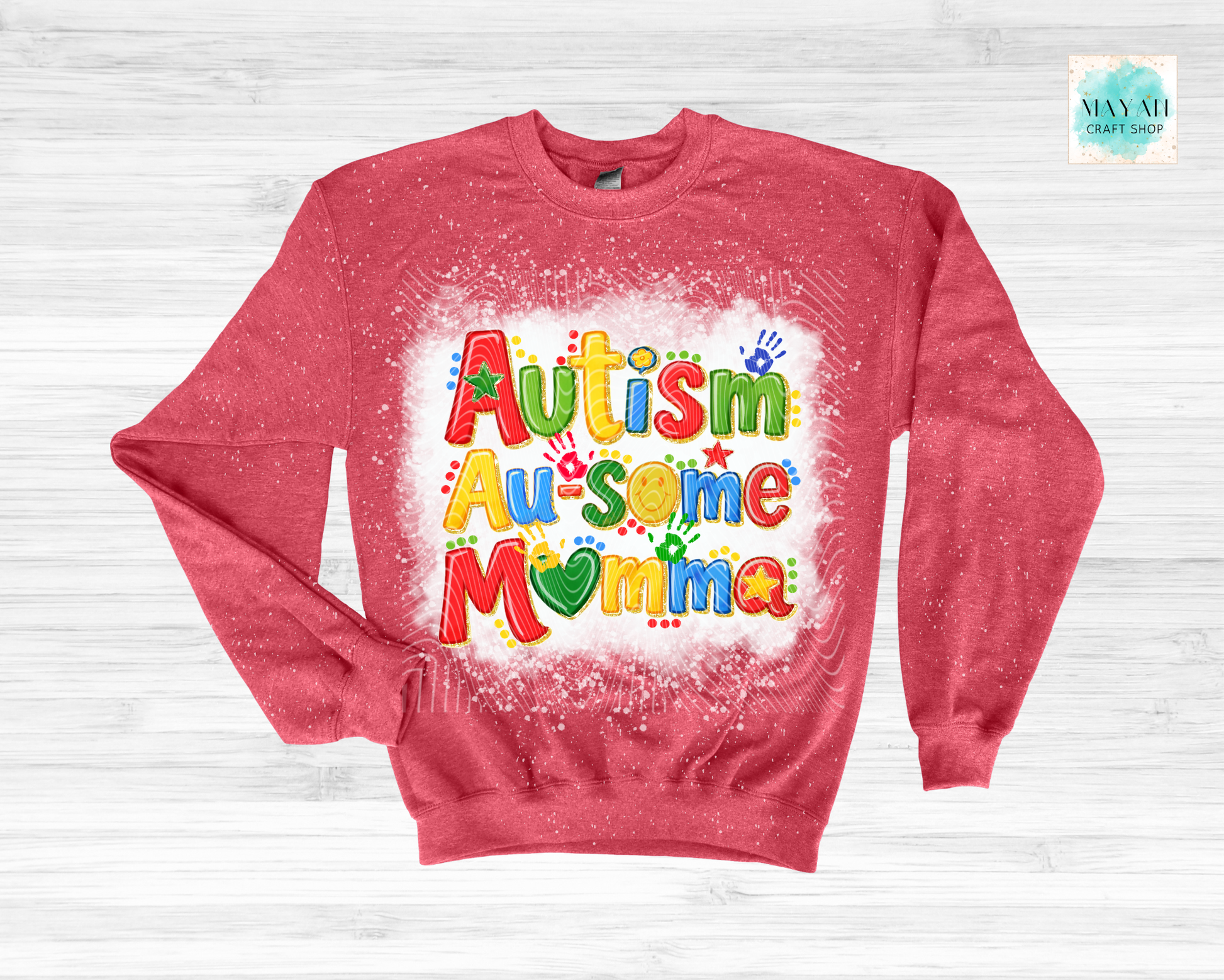 Red sweatshirt with 'Autism Au-some Momma' text on a white background