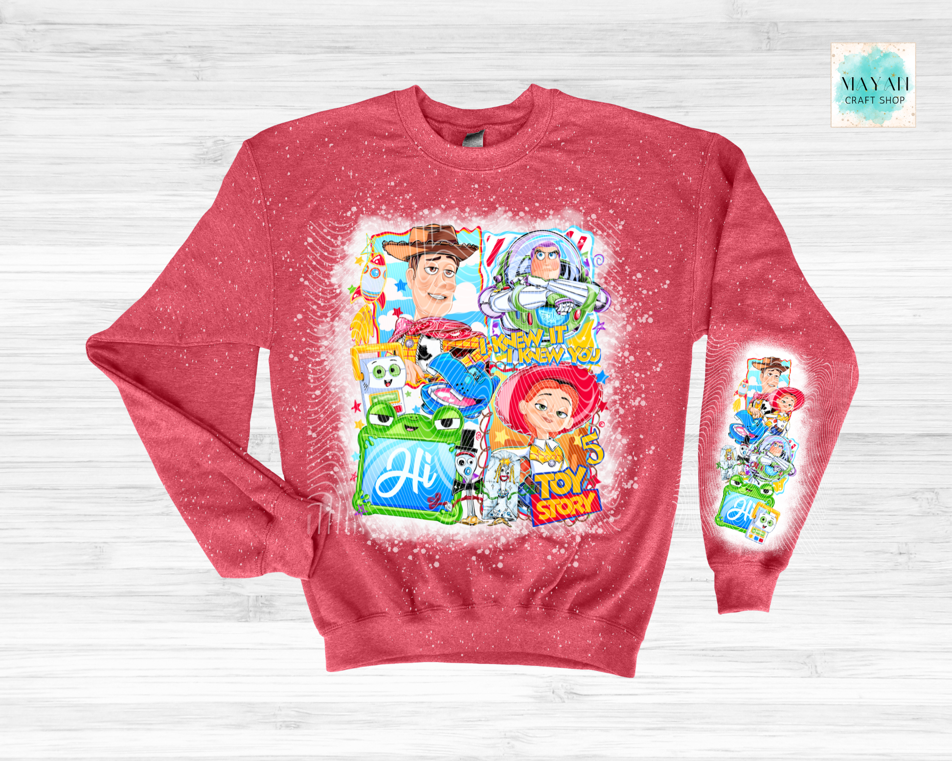 Red sweatshirt with character graphics on a light gray background