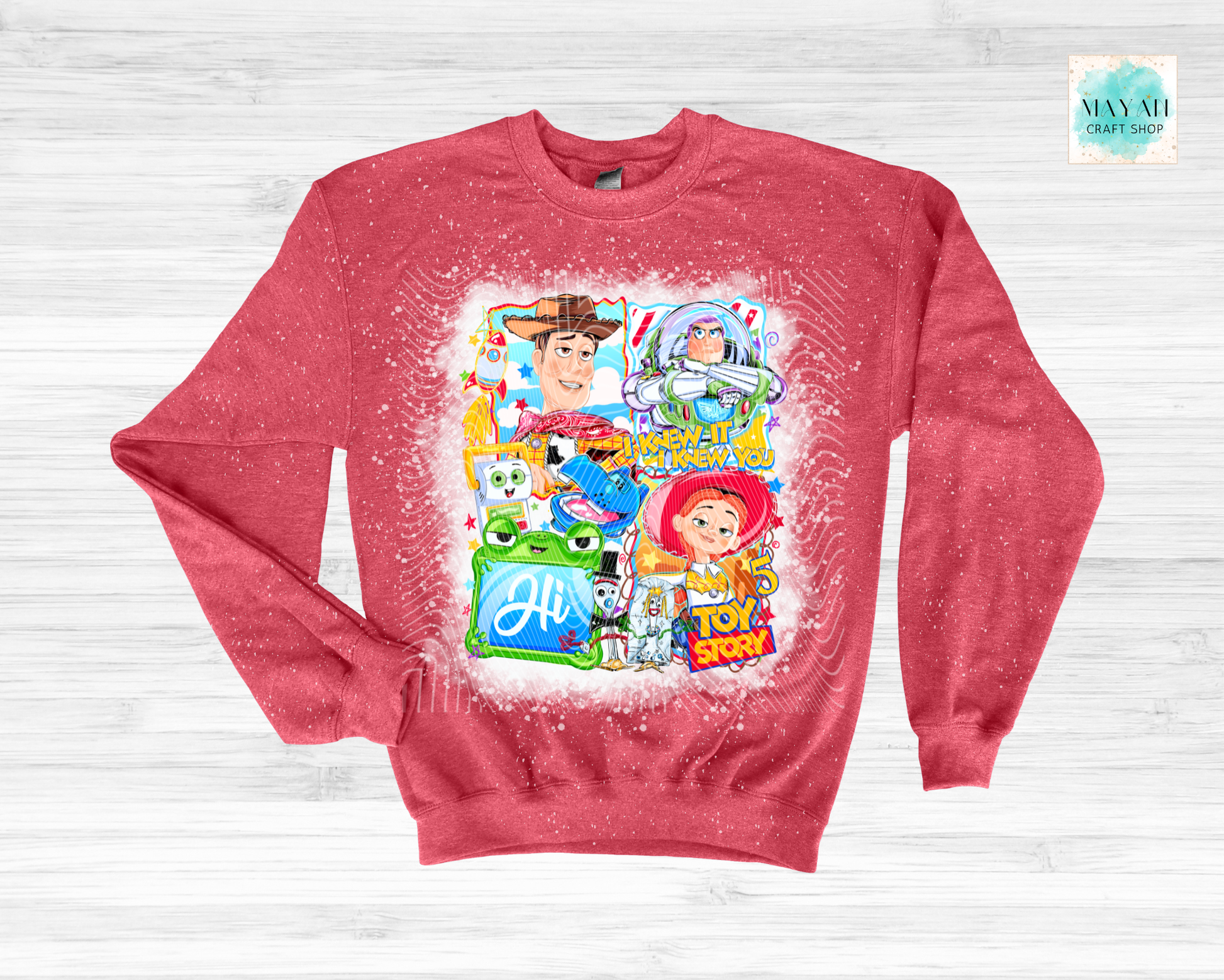Red sweatshirt with character graphics on a light gray background