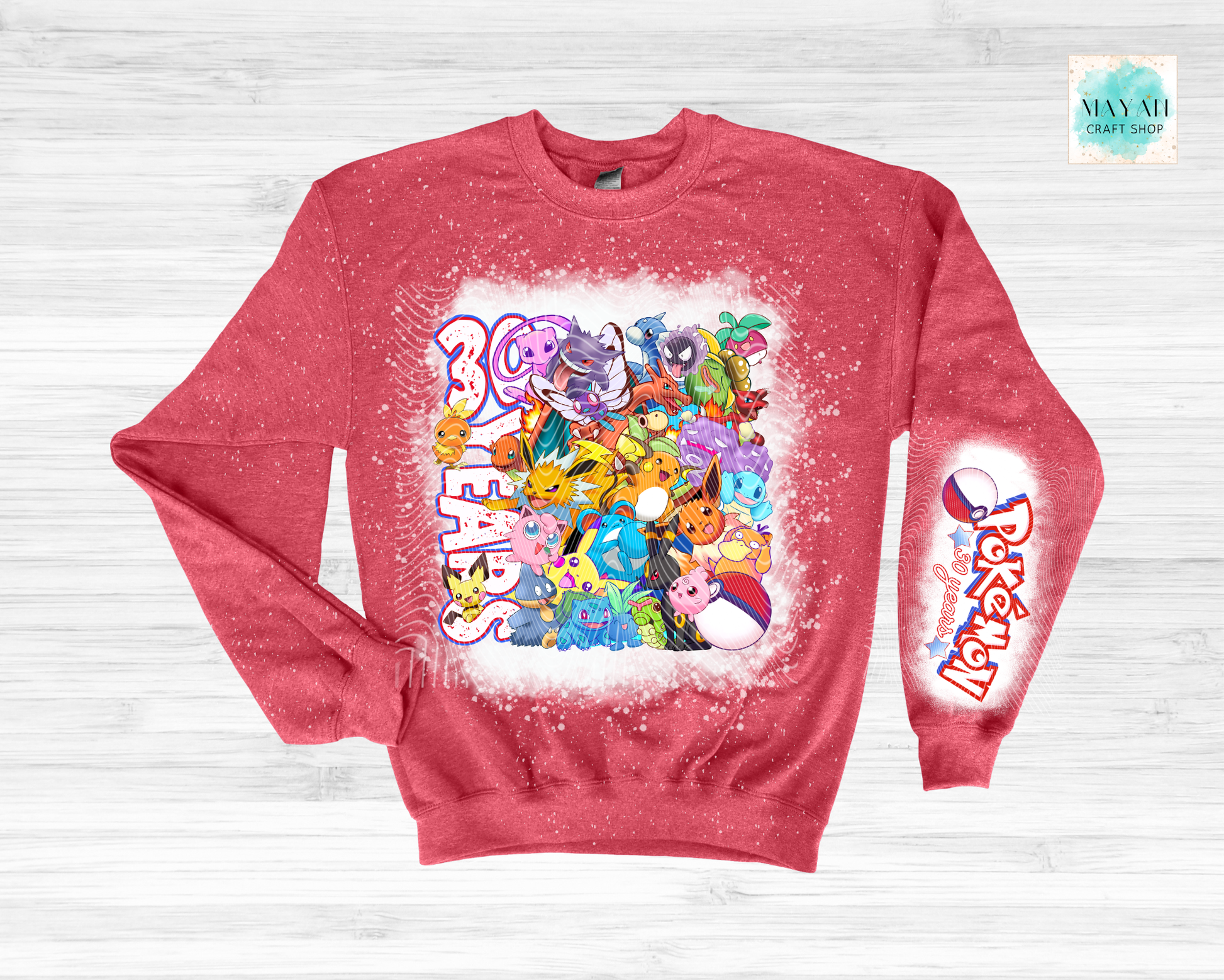 Red sweatshirt with colorful graphic design on a light gray background