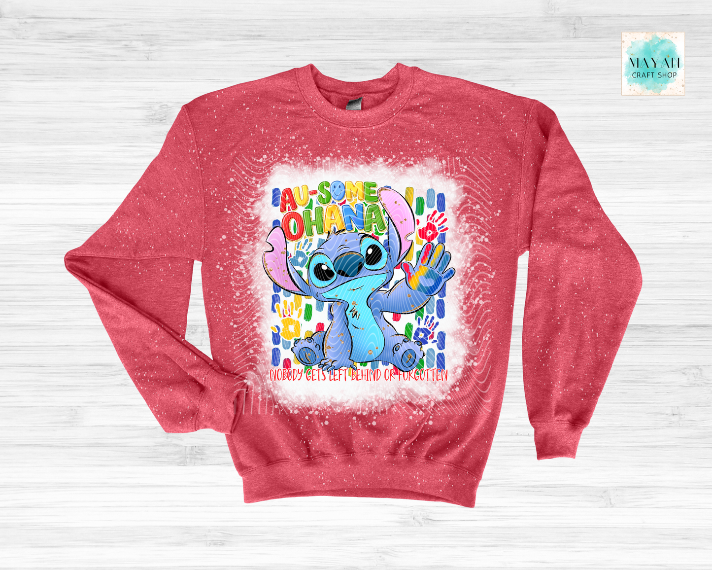 Red sweatshirt with cartoon character and colorful text on a white background