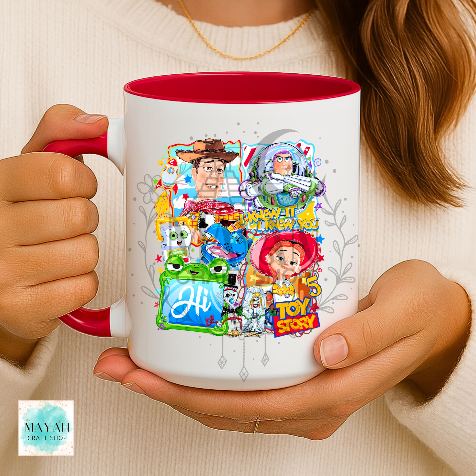 Person holding a mug with characters design
