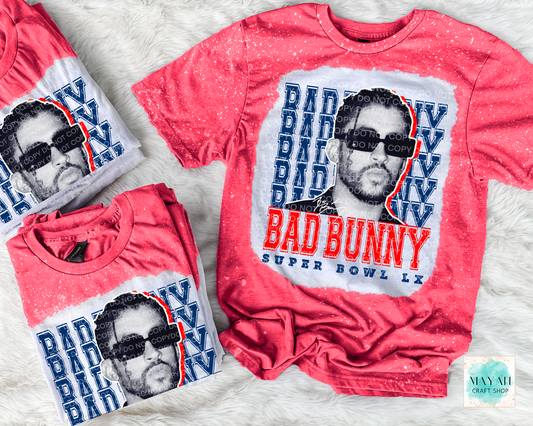 red t-shirt with graphic design on a textured surface