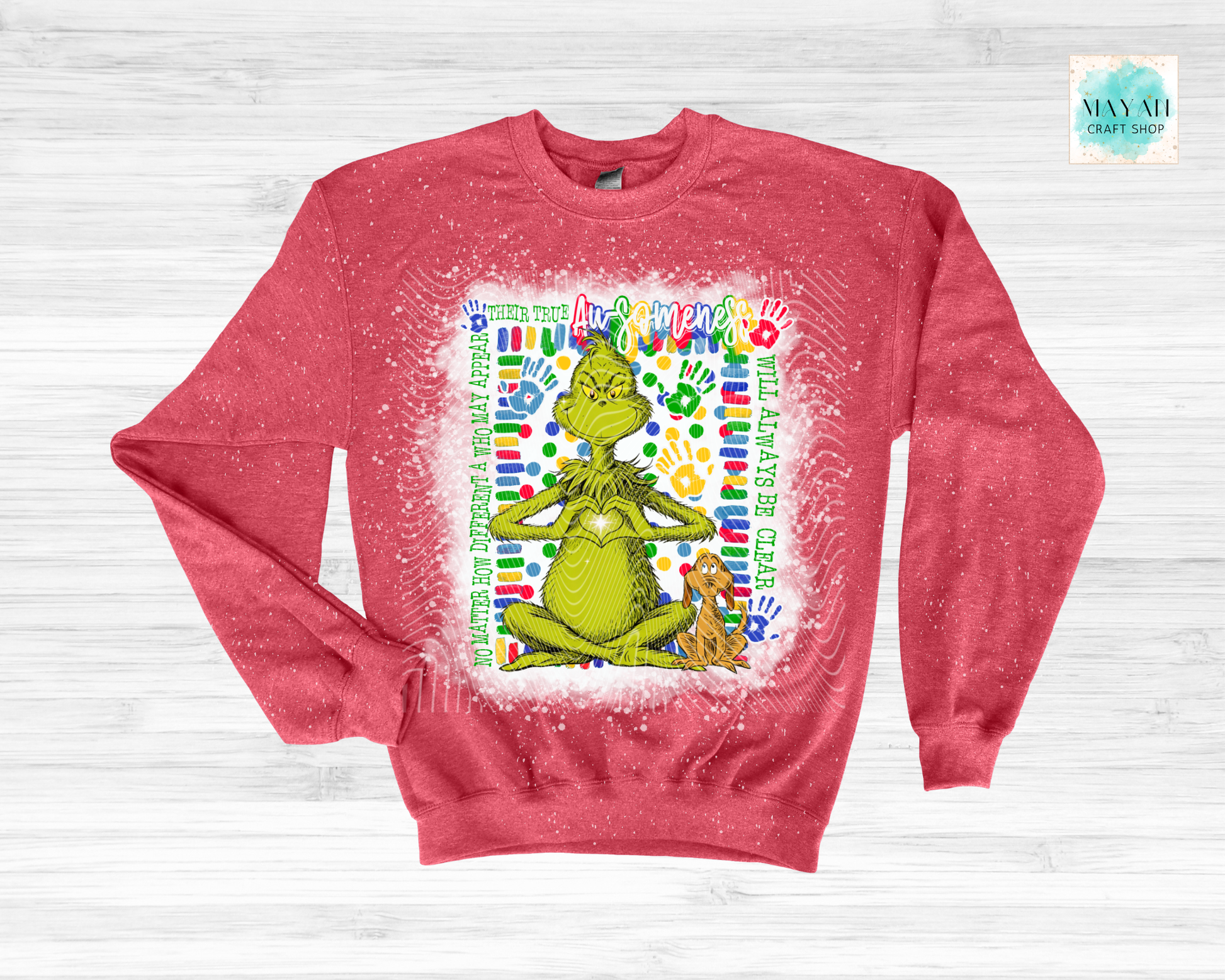 Red sweatshirt with a graphic of a green character and text on a white background