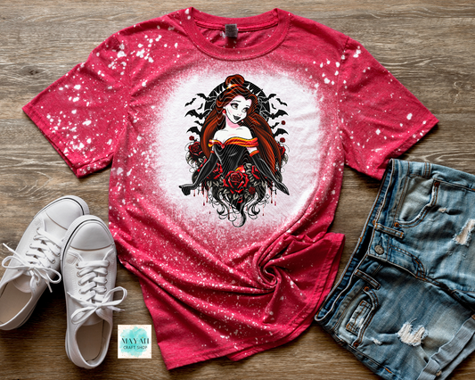 Red t-shirt with graphic design, white sneakers, and denim shorts on a wooden surface