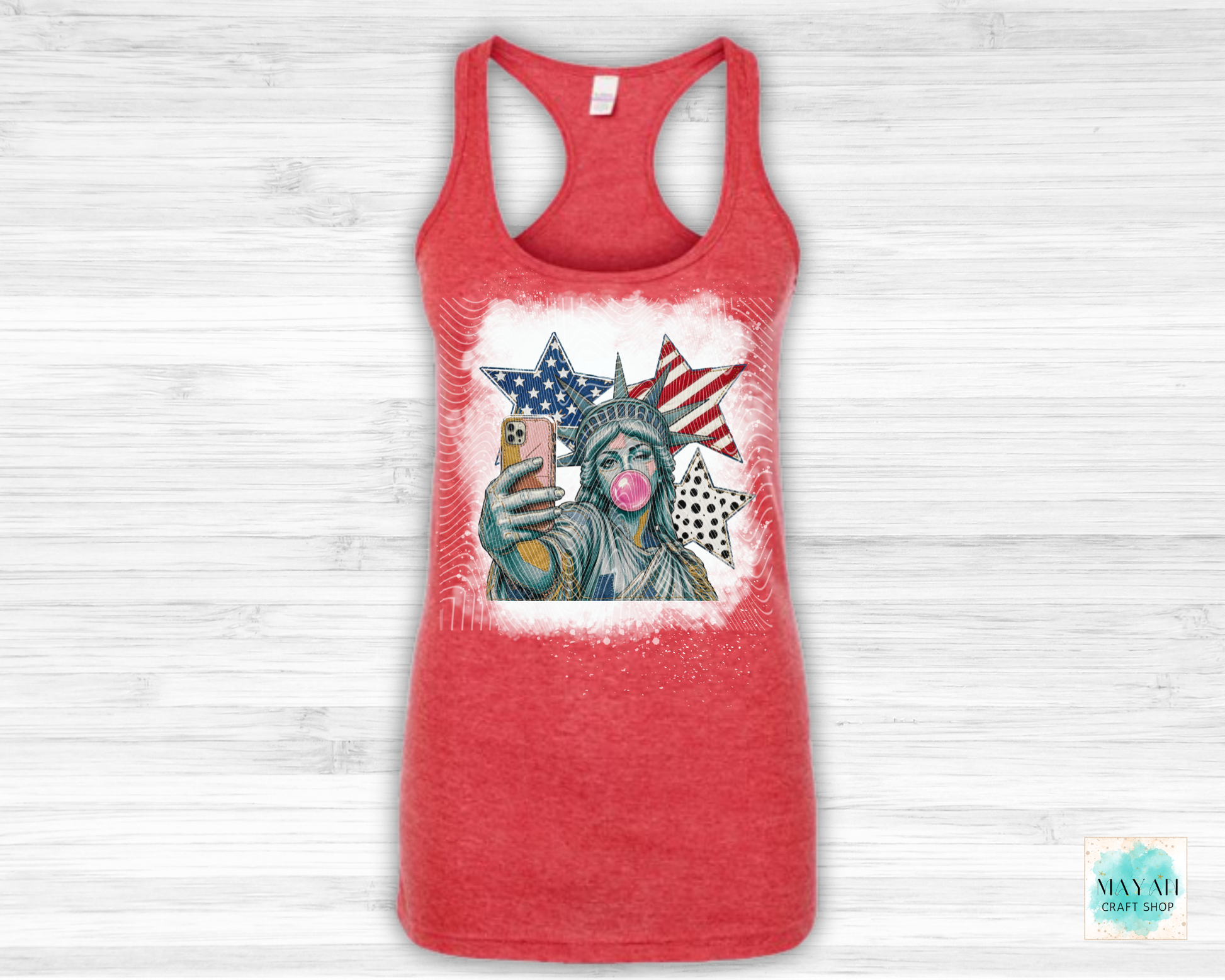 Red tank top with a graphic of the Statue of Liberty holding an American flag on a white background