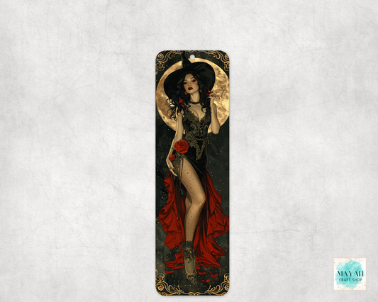Decorative bookmark with an illustration of a woman in a black dress and red cape on a textured white background.