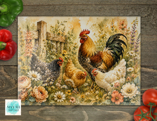 Cutting boards with rooster and hens in a garden scene on a wooden surface.