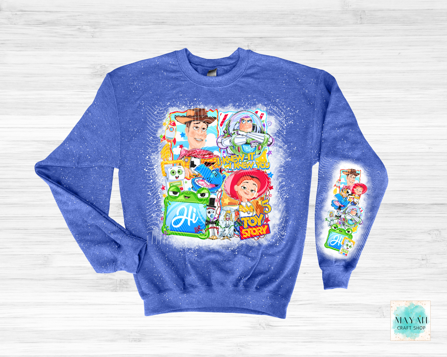 Blue sweatshirt with character graphics on a light gray background