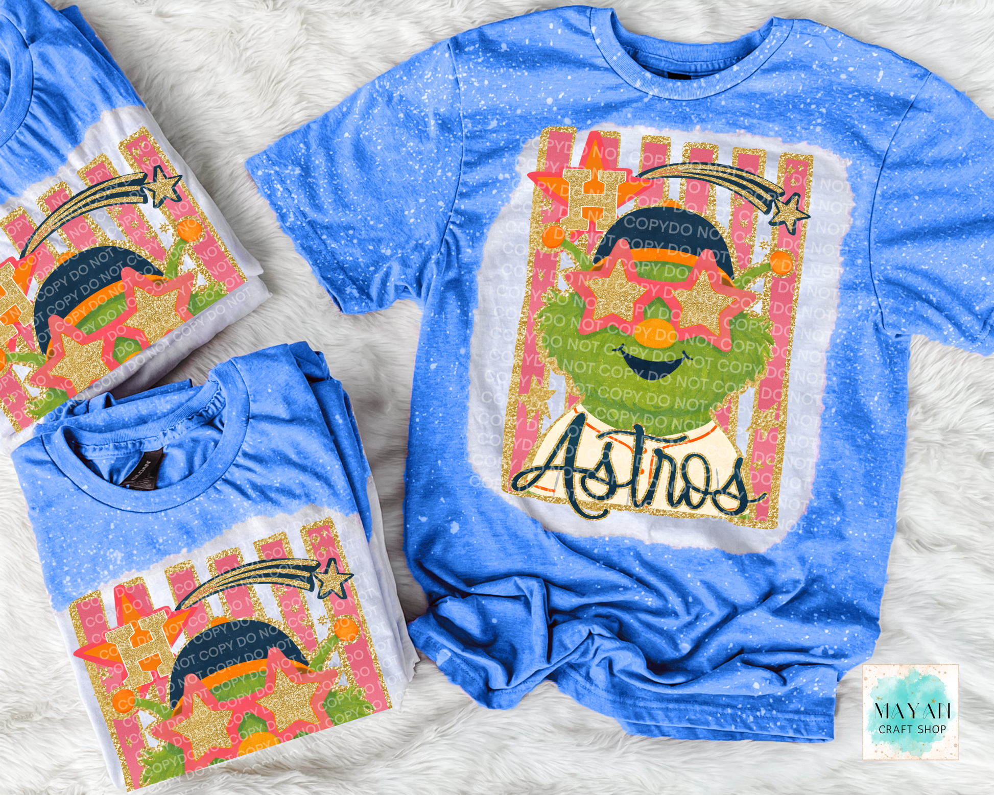 Blue t-shirt with colorful graphic design on a textured surface