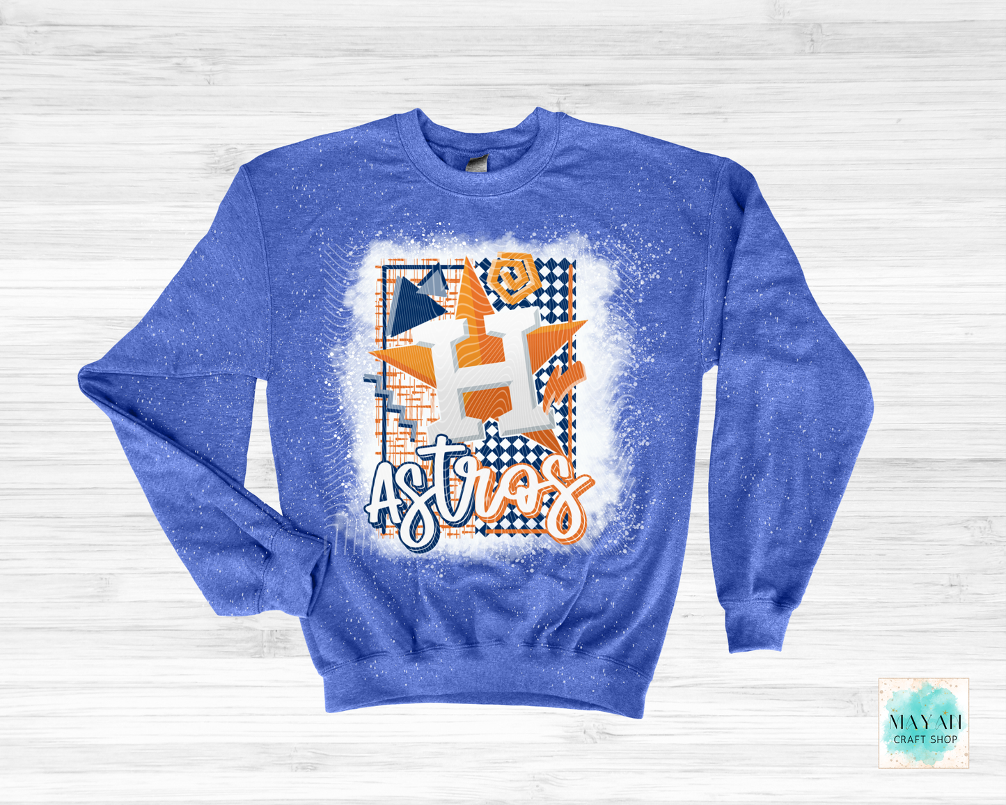 Blue sweatshirt with geometric design  text on a light wooden background