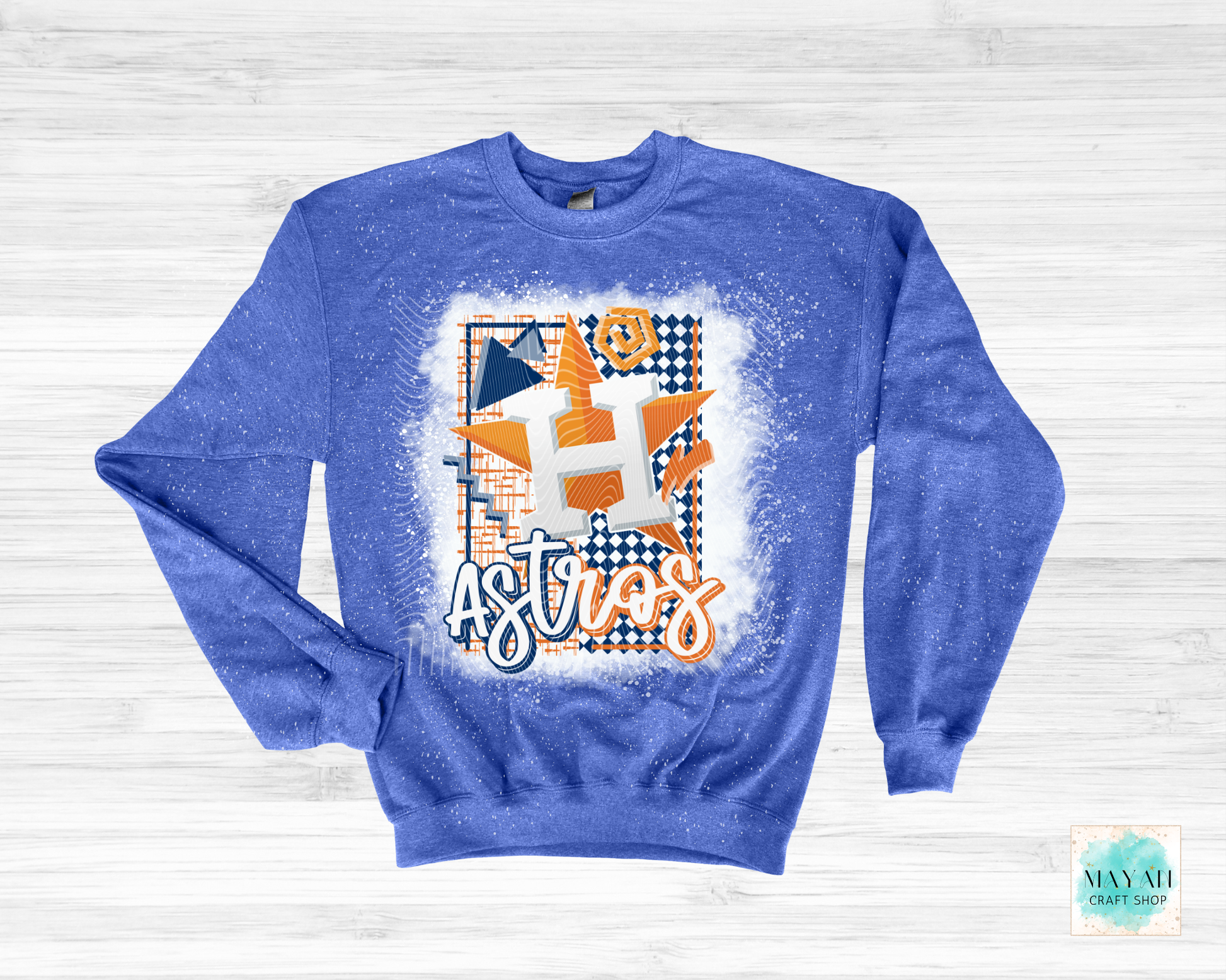 Blue sweatshirt with geometric design  text on a light wooden background