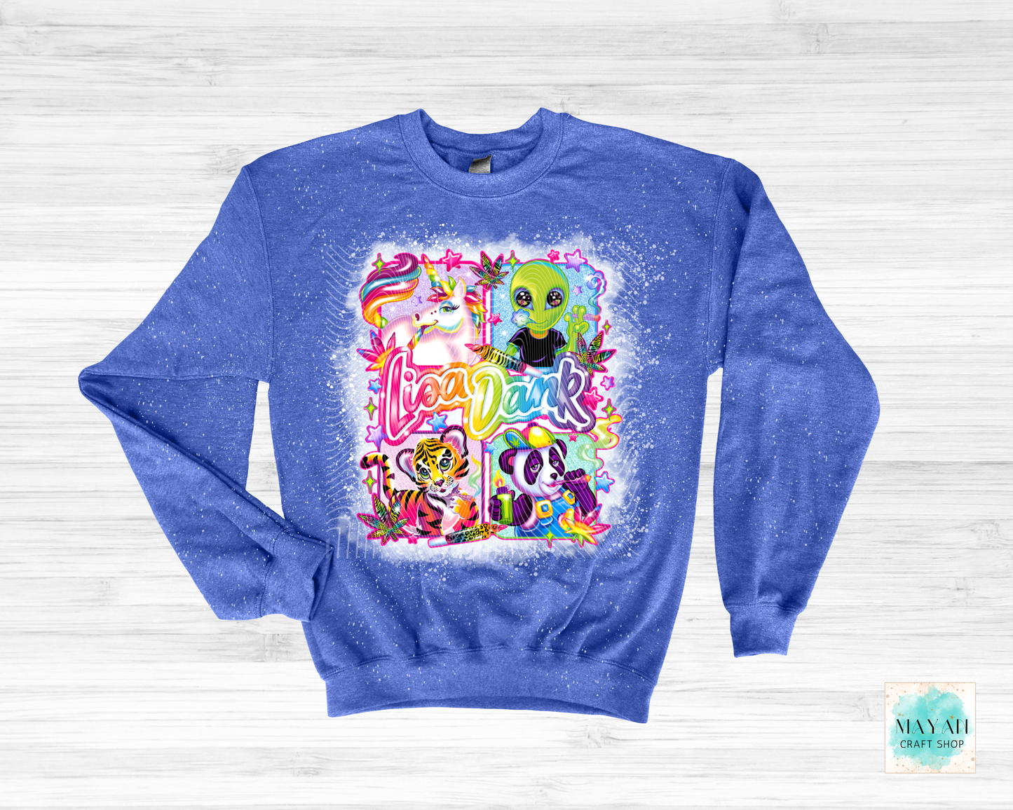 Blue sweatshirt with colorful graphic design on a white wooden background
