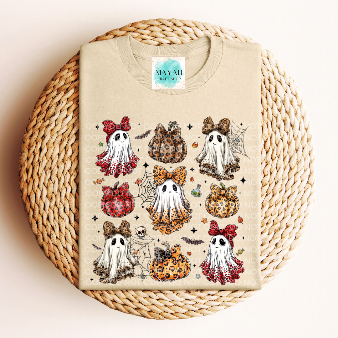 Beige t-shirt with Halloween-themed design on a woven surface