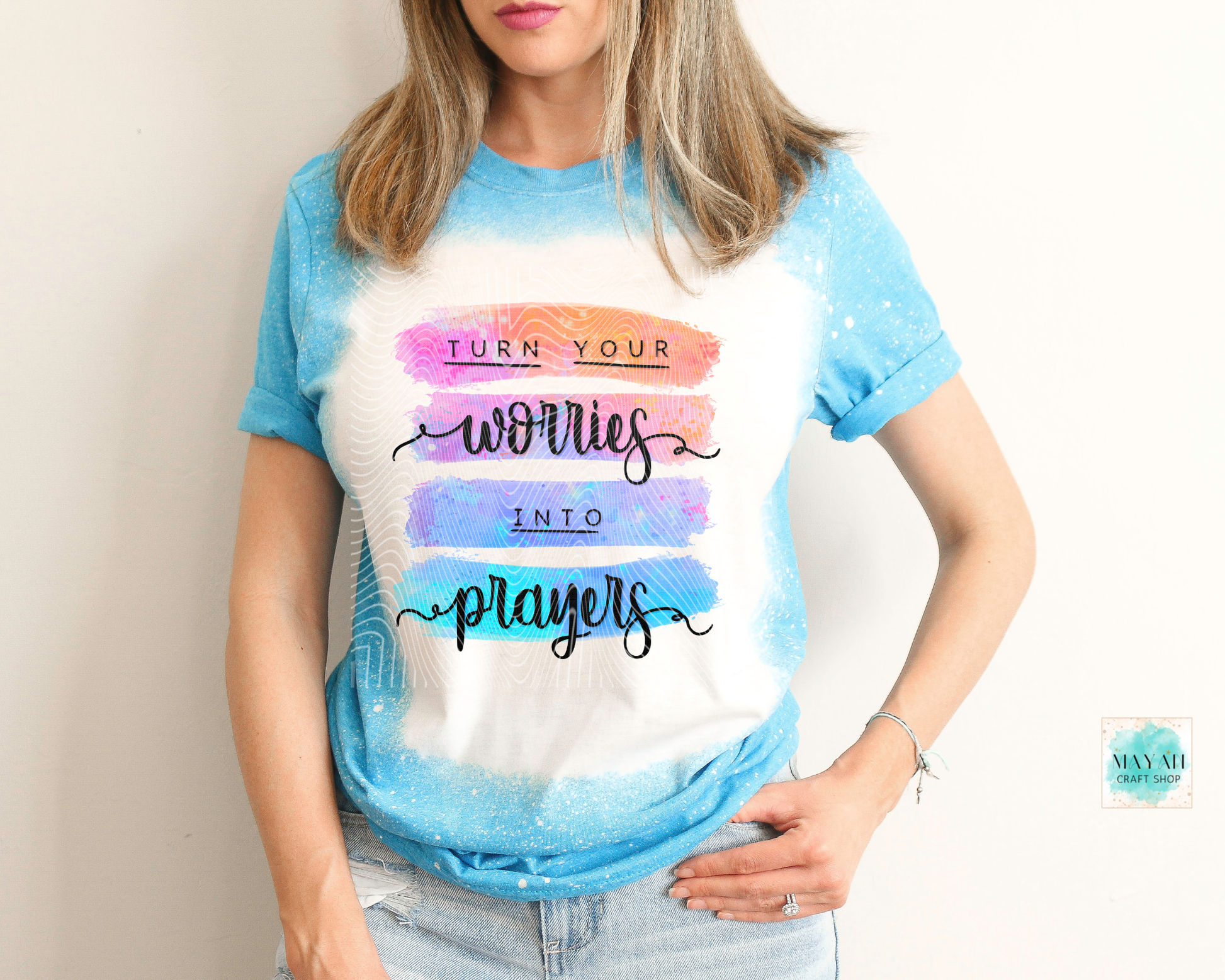 Person wearing a t-shirt with motivational quote and colorful design