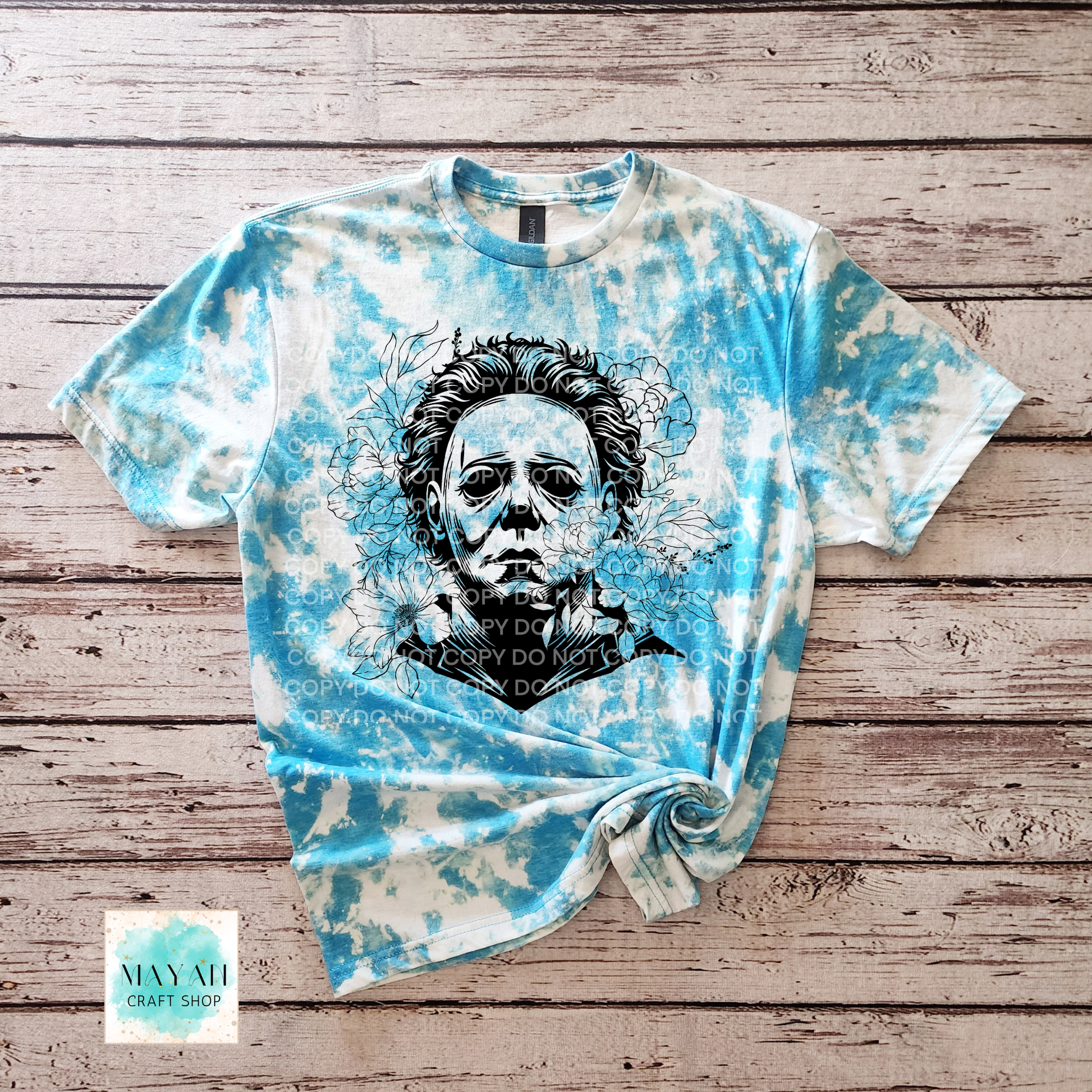 Bleached t-shirt with a graphic design on a wooden surface