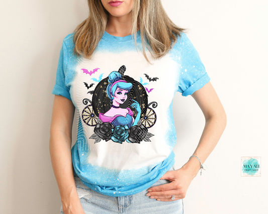Person wearing a t-shirt with a colorful graphic design on a plain background