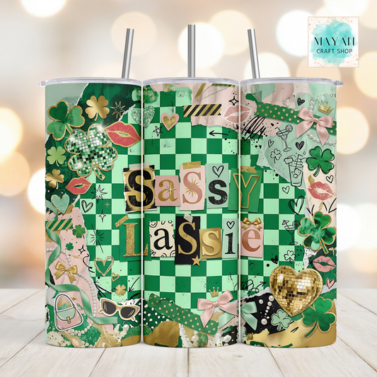 Three green patterned tumblers with decorative designs on a blurred background.