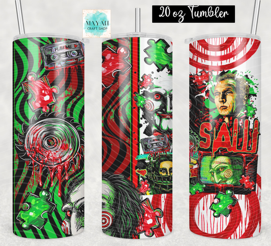 Three views of a 20 oz skinny tumbler with a horror collage print, featuring green and red patterns, skulls, and cassette tapes, shown on a light gray background.