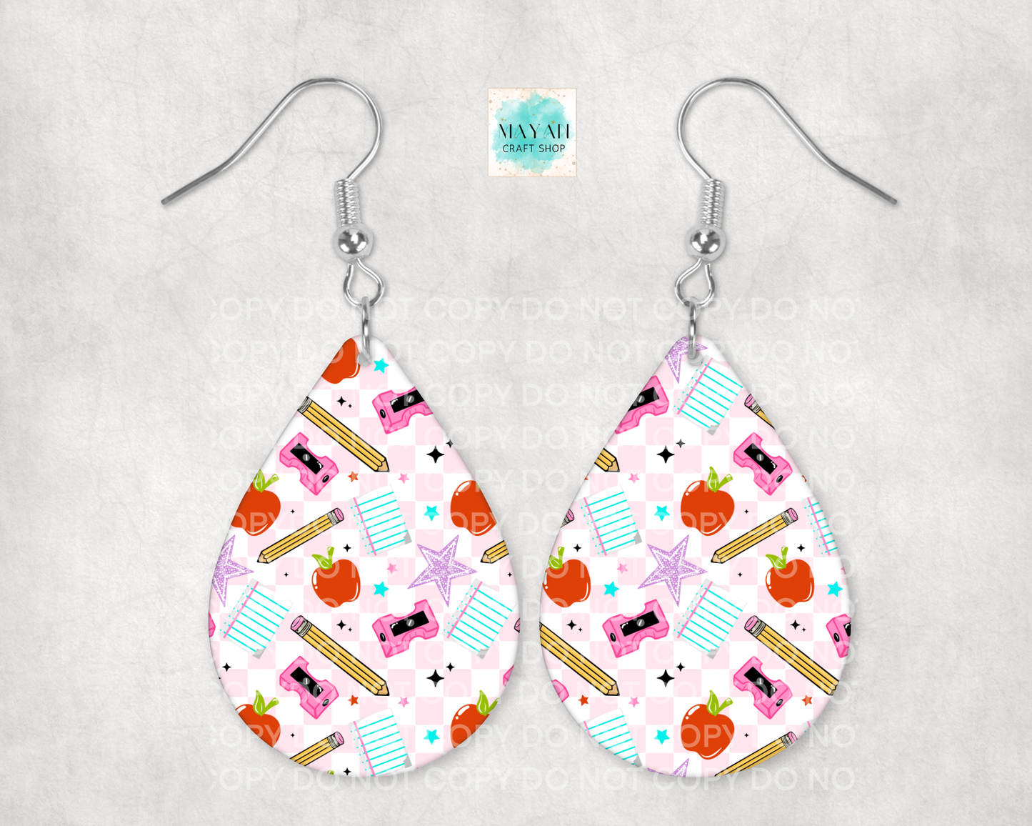 Teardrop-shaped earrings with a colorful pattern on a gray background
